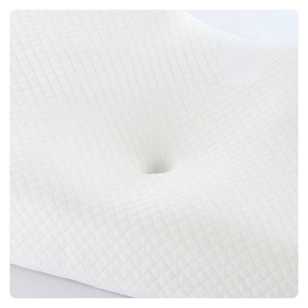 The picture is a closeup of the head cradle in the center of the pillow. The picture highlights the ergonomic contour design and how the pillow supports the natural curvature of the spine to improve alignment.